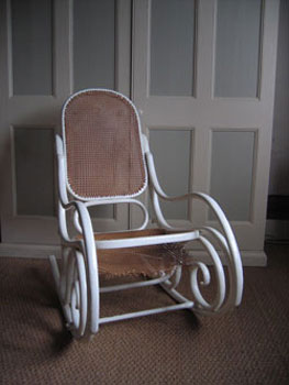 This picture is of the Thonet rocking chair when it first arrived,
tatty and covered in paint with the seat hanging down.