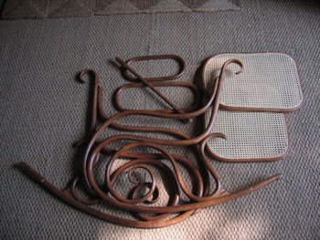 This picture shows the Thonet chair in
pieces on the floor, having been stripped, recaned and polished.